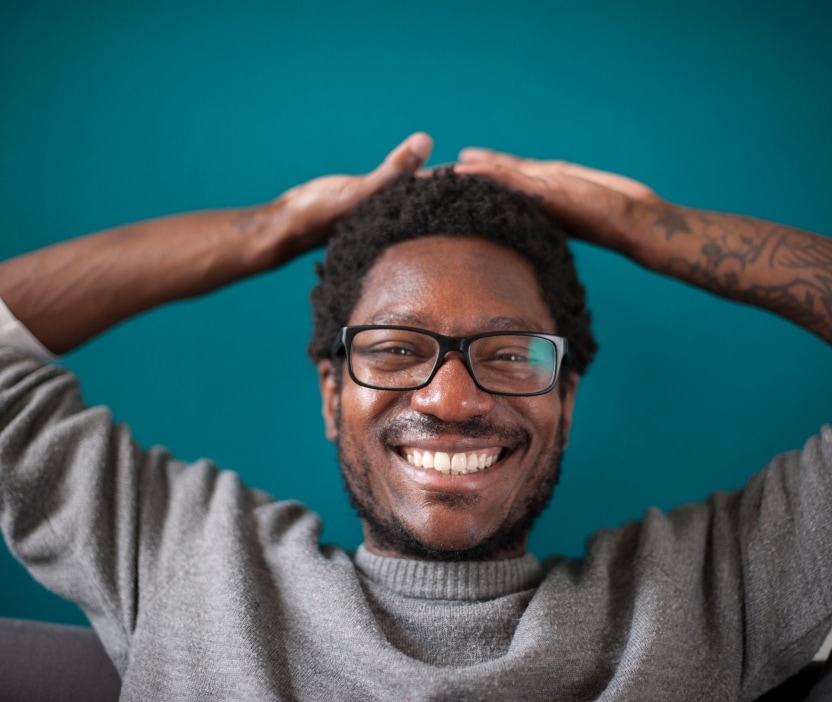 A cyber geek smiles into the camera.