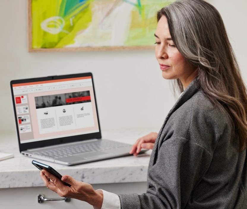 A woman looks down at her phone and wonders if she’s been a target of a Double-Dip Deception Scam.