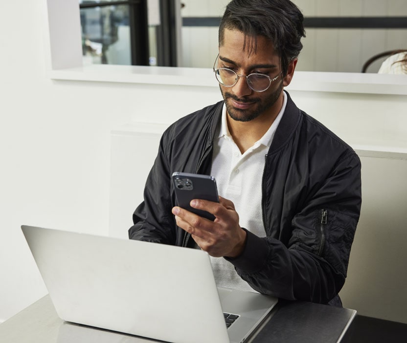 A man creating a secure password for an account on his mobile device.