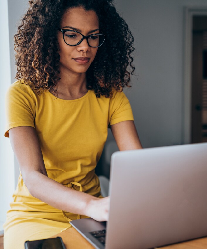 A business owner looks at her screen to determine if the email she received is a credential stuffing attack.