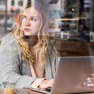 A woman researching VPN tunnels on her computer.