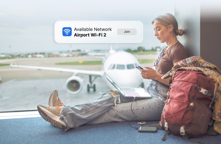 Woman at the airport with her laptop and phone