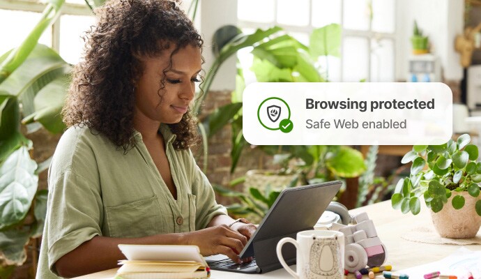 Internet browsing protection - a woman checking her email on her laptop.