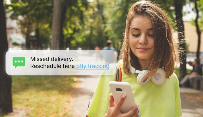 Text message and call protection - a woman checking her messages on her phone.